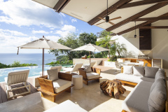 Covered outdoor lounge with ocean views at Villa Belvedere Costa Rica