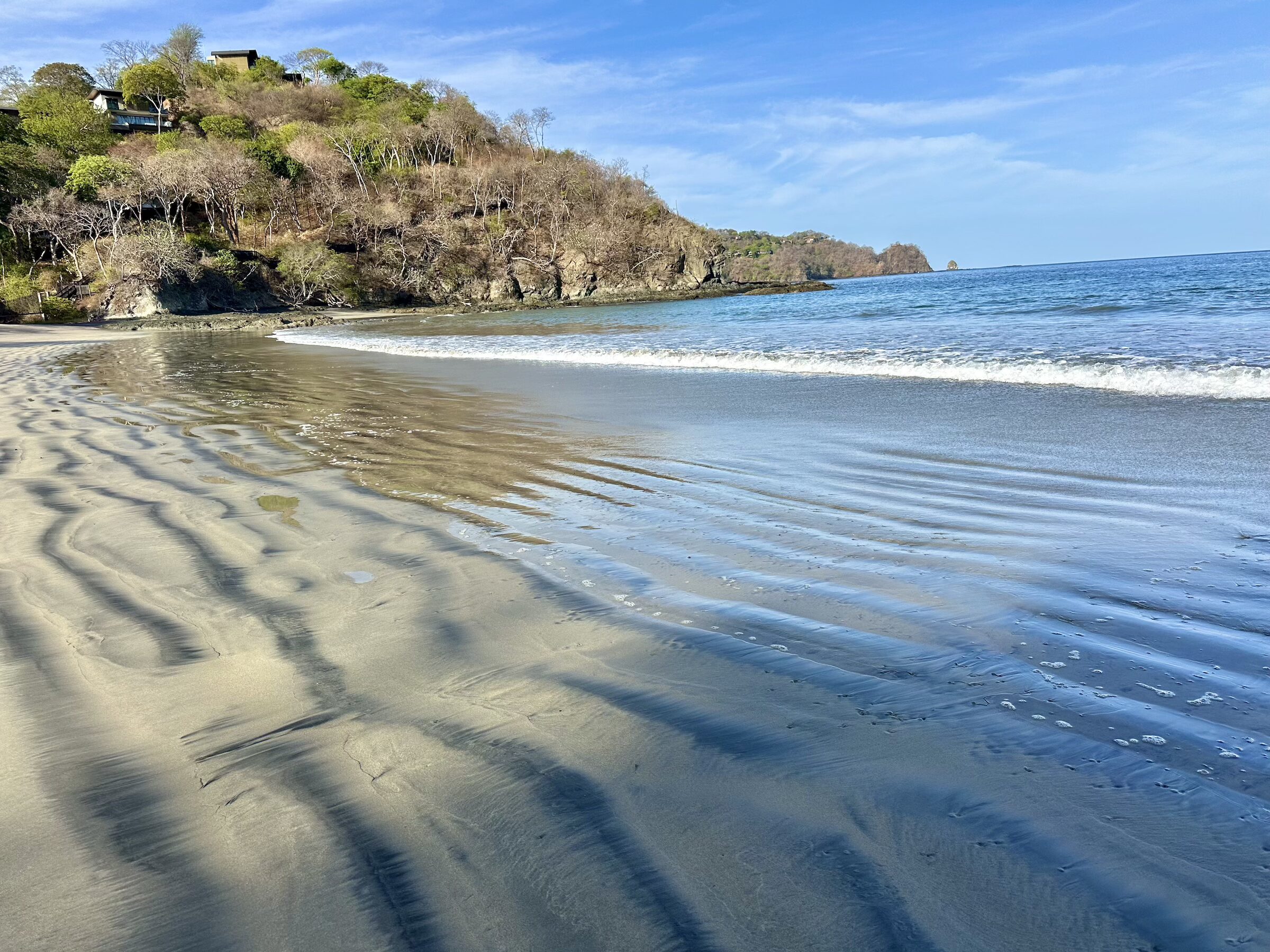 Calm waters and crescent shoreline at Playa Prieta in Peninsula Papagayo, Costa Rica.