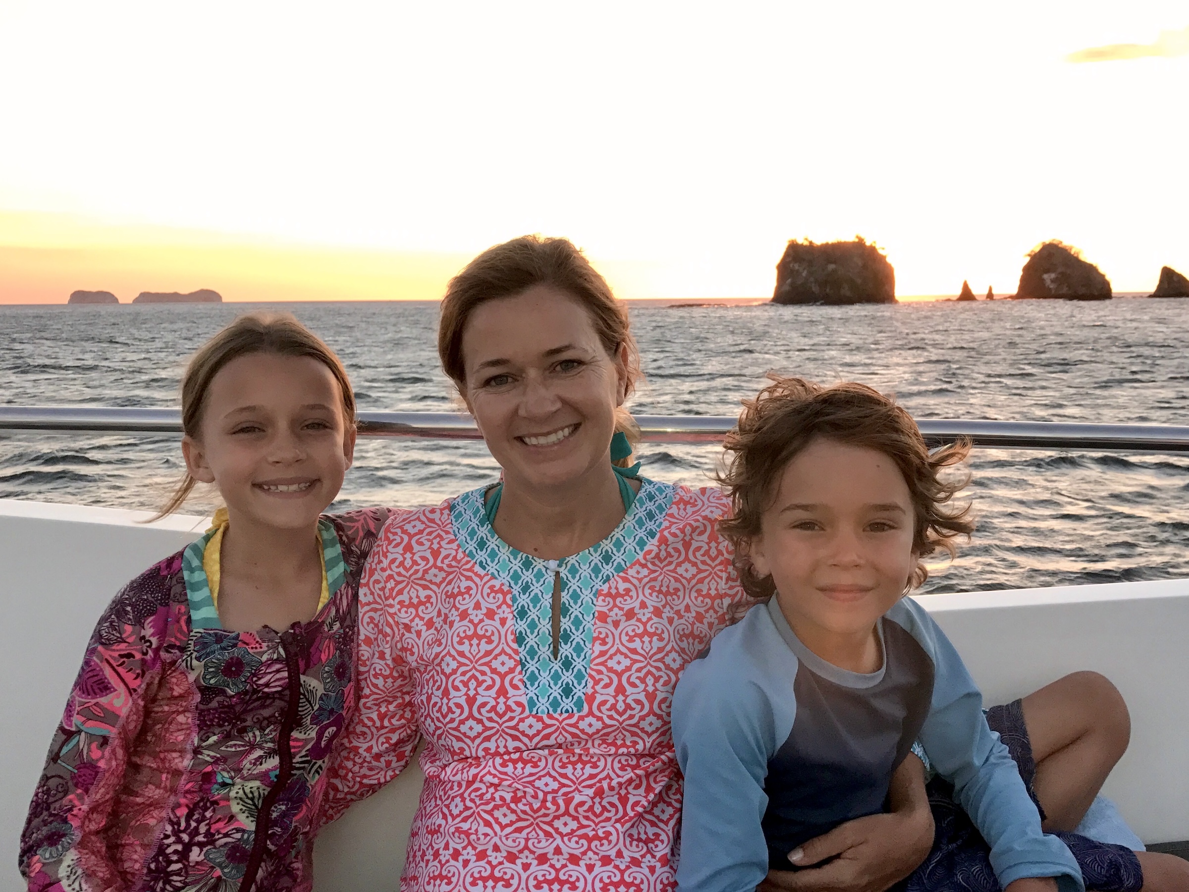 Jane Moore and her children enjoying a sunset yacht cruise in Peninsula Papagayo, Costa Rica