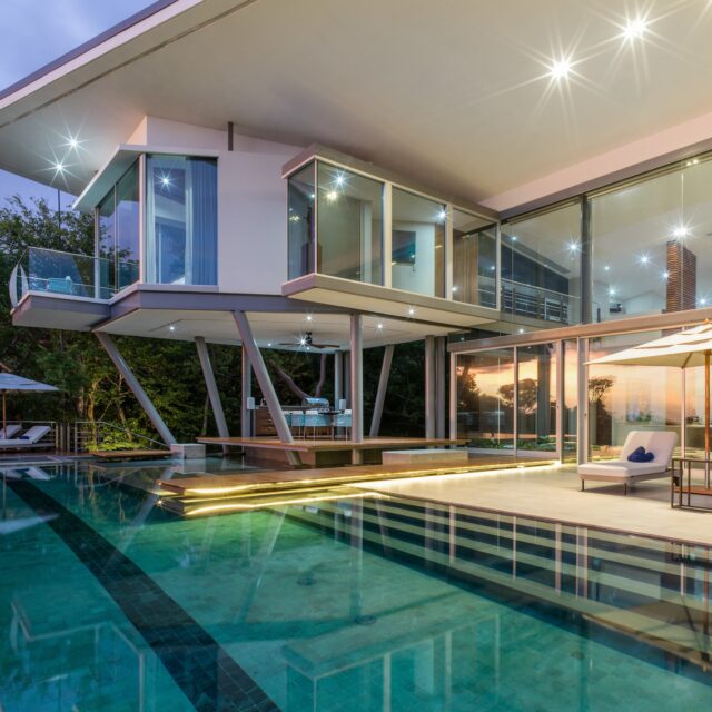 Contemporary Sky's Edge villa at Peninsula Papagayo illuminated at dusk